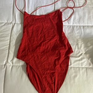 body suit open crisscross back never worn
